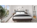 Cozy bedroom with a grey headboard, two lamps, and gallery wall at 52002 W Sotol Rd, Maricopa, AZ 85139