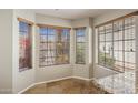 Cozy breakfast nook area featuring three windows, neutral paint, and tile flooring at 11049 N 111Th Way, Scottsdale, AZ 85259
