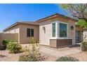 Single-story home with stone exterior and desert landscaping in a peaceful neighborhood at 12083 W Peak View Rd, Peoria, AZ 85383