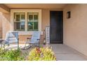 Cozy front porch with rocking chairs and welcoming decor at 12238 W Patrick Ct, Sun City, AZ 85373