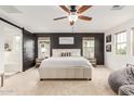 Spacious main bedroom with a large bed, stylish decor, and abundant natural light at 13380 N 148Th Ave, Surprise, AZ 85379