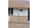 Close up of front door with window and painted horizontal privacy fence at 138 E Monte Way, Phoenix, AZ 85042