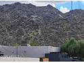 A view of the property exterior with a mountain in the background at 138 E Monte Way, Phoenix, AZ 85042