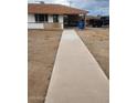 View of front yard and sidewalk leading to the covered car port on the house at 138 E Monte Way, Phoenix, AZ 85042