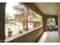 View of the outdoor community pool and balcony with chairs offering a relaxing outdoor experience at 15252 N 100Th St # 1172, Scottsdale, AZ 85260