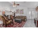 Bright and airy living space featuring an open layout, tile floors, and comfortable furniture, perfect for relaxation at 16654 N 19Th Pl, Phoenix, AZ 85022