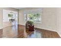 Bright living room featuring hardwood floors and backyard views at 19018 N Concho Cir, Sun City, AZ 85373