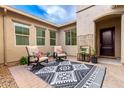 Charming patio with a decorative rug and comfortable armchairs, perfect for outdoor relaxation at 20256 E Canary Ct, Queen Creek, AZ 85142