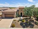 Stunning aerial view of home with stone accents, tile roof, and manicured desert landscaping at 28375 N 130Th Dr, Peoria, AZ 85383