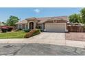 Attractive single-Gathering home with a well-manicured lawn and a spacious two car driveway at 3059 E Tyson Ct, Gilbert, AZ 85295