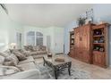 Comfortable living room featuring neutral walls, tile flooring, and a cozy seating arrangement at 3059 E Tyson Ct, Gilbert, AZ 85295