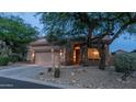 Desert landscaping enhances this home's curb appeal, complemented by a two-car garage and neutral exterior at 3521 N Barron --, Mesa, AZ 85207