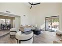 Bright living room with modern furnishings and a sliding door to the backyard at 4024 E Hiddenview Dr, Phoenix, AZ 85048