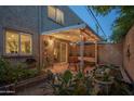 A private backyard boasts a covered patio, garden beds, and a pond perfect for relaxation and outdoor dining at 4431 N 21St Pl, Phoenix, AZ 85016