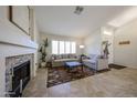 Cozy living room features a fireplace, comfortable seating, and natural light at 4558 E Libby St, Phoenix, AZ 85032