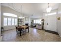 Inviting living room featuring a fireplace, dining area, and tiled floor at 4558 E Libby St, Phoenix, AZ 85032