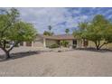 Charming single story home featuring desert landscaping, mature trees and a two car garage at 5330 E Tierra Buena Ln, Scottsdale, AZ 85254