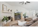 Bright living room with a tiled fireplace, high ceilings, and comfortable seating at 5415 E Juniper Ave, Scottsdale, AZ 85254