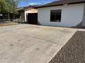 Spacious driveway leading to backyard with a privacy gate at 5539 W Wilshire Dr, Phoenix, AZ 85035