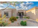 Home exterior featuring desert landscaping, decorative rocks and beautiful plants at 6996 E Mighty Saguaro Way, Scottsdale, AZ 85266