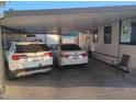 Attached carport providing covered parking for two vehicles with additional storage at 701 S Dobson Rd # 438, Mesa, AZ 85202
