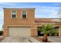Inviting two-story townhome featuring attached two-car garage and well-maintained desert landscaping at 7064 W Lincoln St, Peoria, AZ 85345