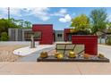 Stylish home with well-maintained xeriscaping, stone walkway, and modern architectural details at 8314 E Vista Dr, Scottsdale, AZ 85250