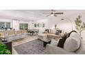 Open floor plan shows the living room, dining room, and kitchen with lots of seating at 8437 E Bonnie Rose Ave, Scottsdale, AZ 85250