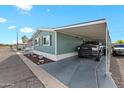 Charming home with covered parking and a car parked underneath at 8600 E Broadway Rd # 30, Mesa, AZ 85208