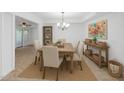 Bright dining room featuring seating for six and stylish décor and ample natural light at 13424 N Emberwood Dr, Sun City, AZ 85351