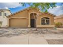 Charming single story home featuring a two car garage, low maintenance landscaping, and a welcoming front porch at 16661 W Belleview St, Goodyear, AZ 85338