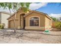 Charming single story home featuring a two car garage, low maintenance landscaping, and a welcoming front porch at 16661 W Belleview St, Goodyear, AZ 85338
