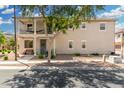 Inviting two-story home with charming balcony and well-maintained front yard landscaping at 1689 E Elgin St, Gilbert, AZ 85295