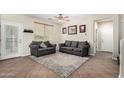 Comfortable living room featuring neutral tones, plush seating, and a stylish area rug at 1689 E Elgin St, Gilbert, AZ 85295