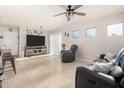 Open concept living room area with neutral walls, tile floors and plenty of natural light at 17970 N 114Th Ln, Surprise, AZ 85378