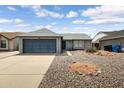 Charming single-story home with a well-maintained front yard and a two-car garage at 20822 N 34Th Dr, Phoenix, AZ 85027
