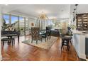 Open living space with sleek furniture, modern lighting, and herringbone floors at 2211 E Camelback Rd # 902, Phoenix, AZ 85016