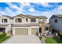 Charming two-story home featuring a two-car garage and inviting front porch at 22771 N 98Th Dr, Peoria, AZ 85383