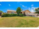 Inviting single-story home with a well-maintained lawn, mature trees, and a boat parked in front at 3237 W Angela Dr, Phoenix, AZ 85053