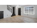 Open entryway with tile floors, a staircase, and natural light from window with blinds at 3687 E Leslie Dr, Gilbert, AZ 85296
