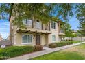 Two story home featuring two balconies, a desert landscape, and manicured hedges at 3687 E Leslie Dr, Gilbert, AZ 85296