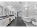 Sleek bathroom with double vanity, a soaking tub, and modern finishes at 704 E Gemini Pl, Chandler, AZ 85249