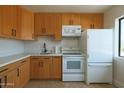 Well-lit kitchen features ample cabinet space, modern appliances, and plenty of counter space at 749 E Montebello Ave # 231, Phoenix, AZ 85014