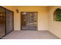 Relaxing outdoor patio space with sliding glass door and views of the community at 10330 W Thunderbird W Blvd # B103, Sun City, AZ 85351