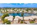 Enjoy this lovely property from above, set on a serene waterfront, surrounded by lush landscaping at 1146 W Sea Fog Dr, Gilbert, AZ 85233