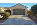 Well-maintained home featuring a spacious two-car garage and a long driveway at 12934 W Chapala Dr, Sun City West, AZ 85375