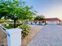 Charming single-story home featuring a red roof, white exterior, and well-manicured landscaping at 15602 N 37Th St, Phoenix, AZ 85032