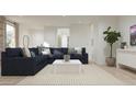 Comfortable living room featuring a plush sectional sofa, stylish decor, and bright, natural lighting at 16677 W Chama Dr, Surprise, AZ 85387