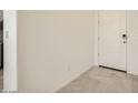 Bright entryway featuring tile flooring, a white front door, and neutral walls at 16754 W Alameda Rd, Surprise, AZ 85387
