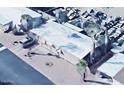 An aerial view of a small one-story home, with a vehicle in the driveway and some trees around the house at 200 E Ivanhoe St, Chandler, AZ 85225